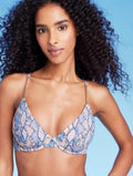 Woman wearing a blue patterned bikini 